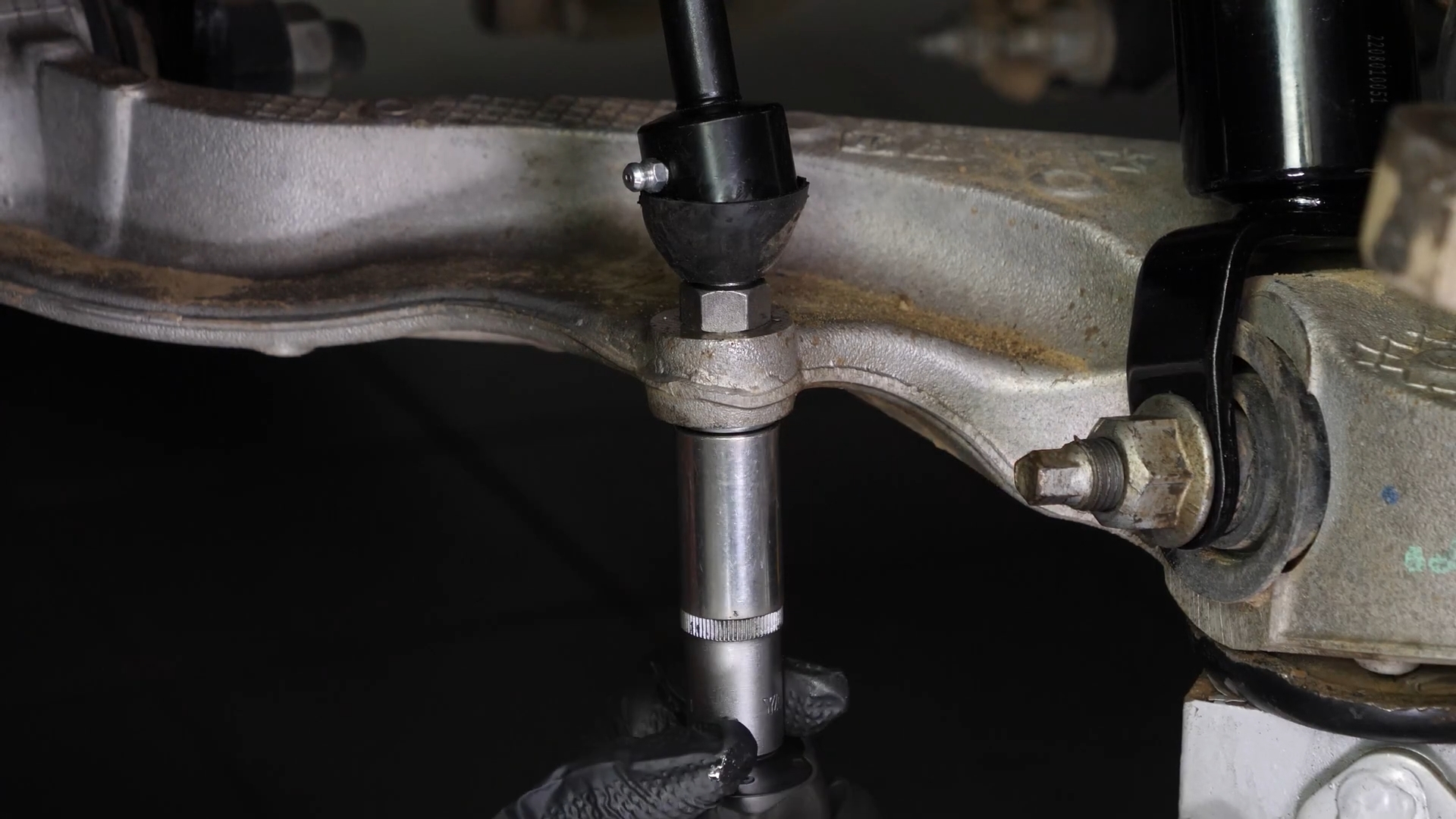 Screw the control arm ball joint nut back
