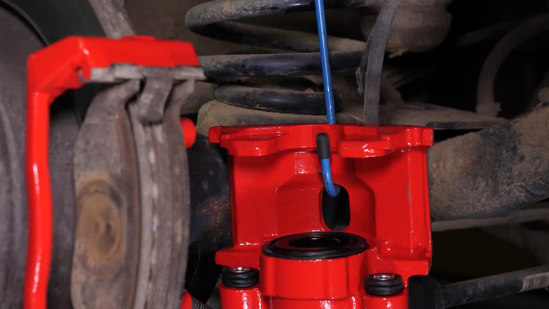 Remove the  brake caliper mount