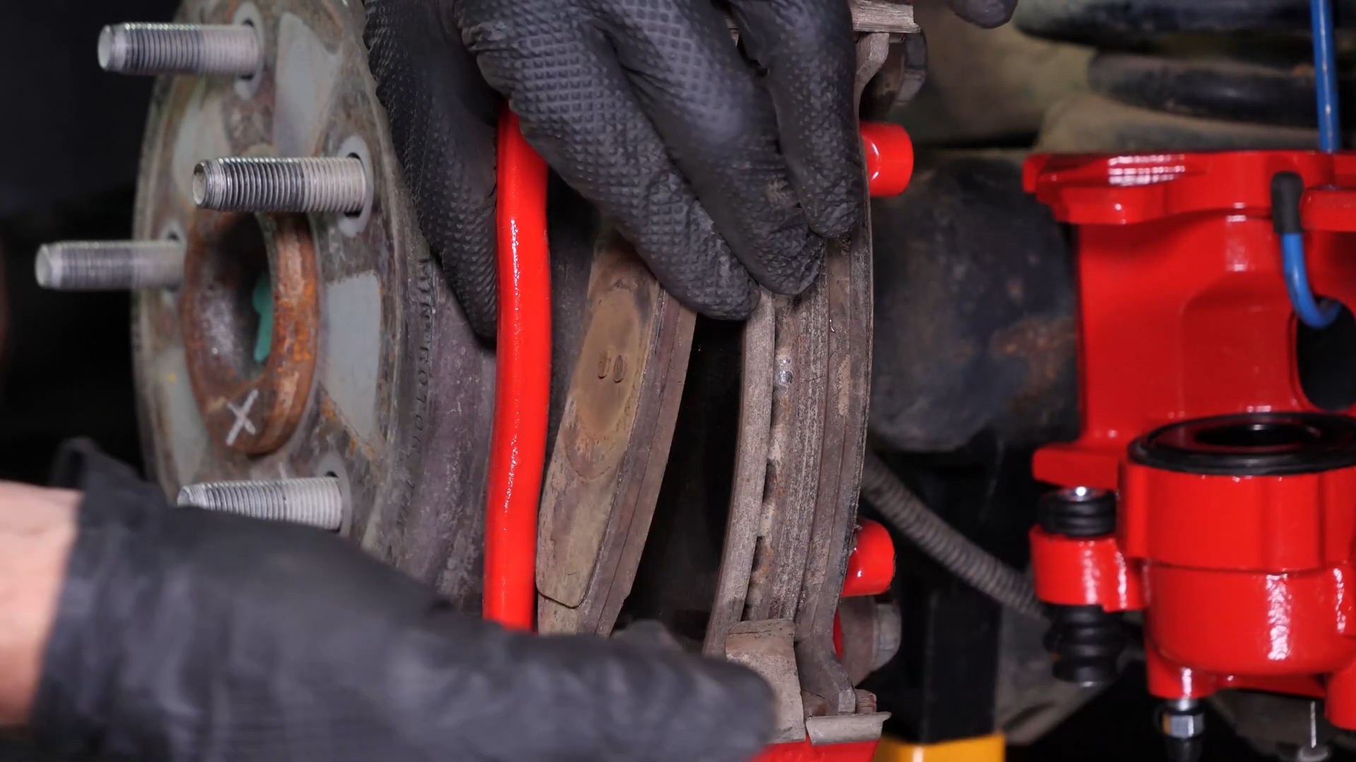 Remove the  brake caliper mount