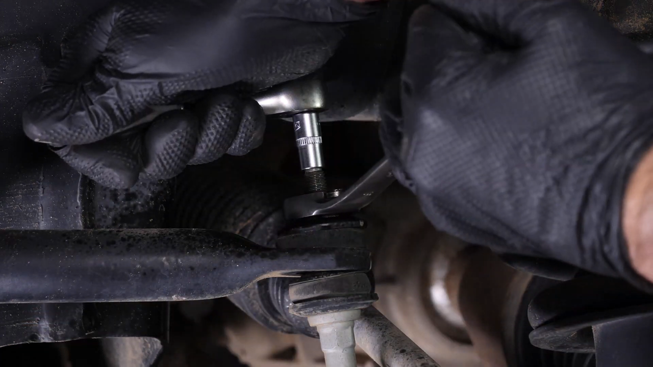 Unscrew the upper ball joint