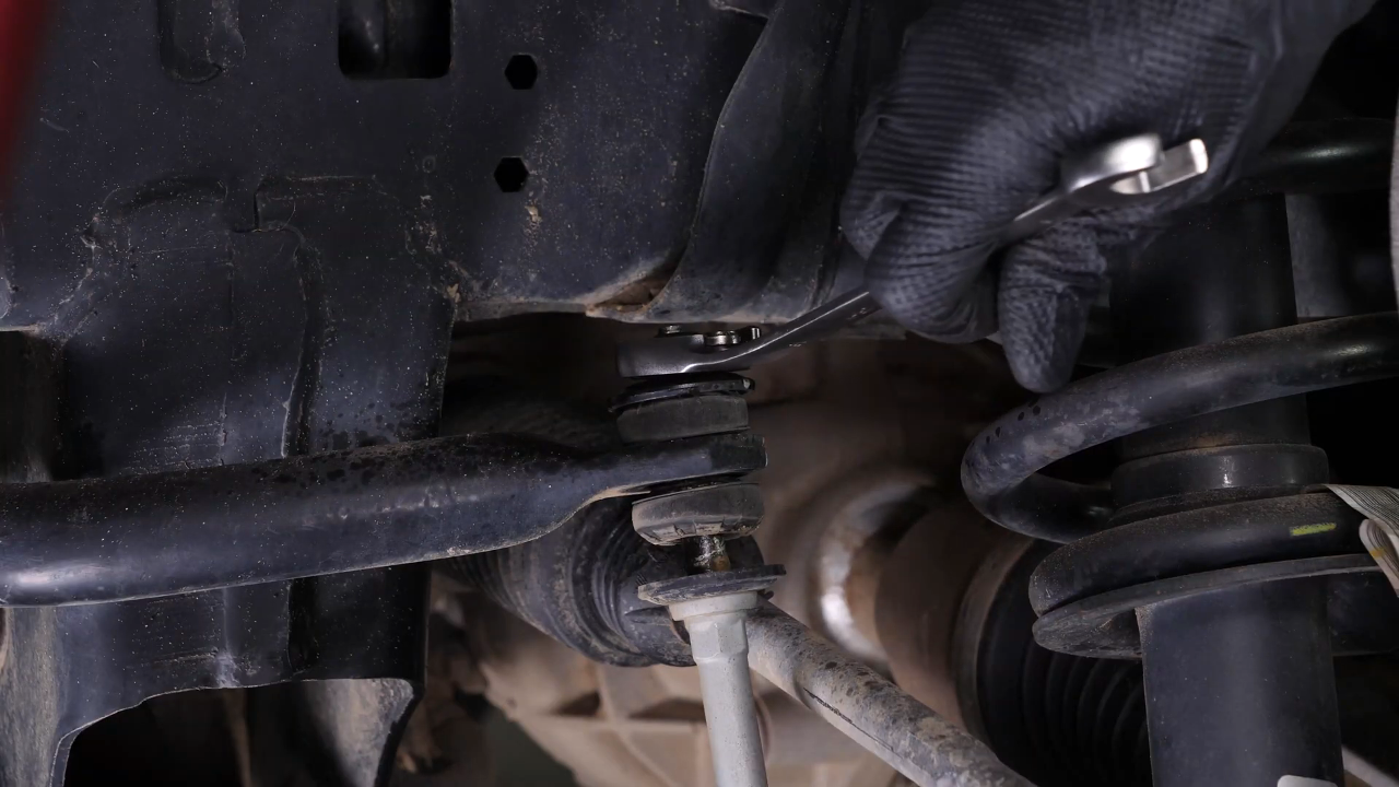 Unscrew the upper ball joint