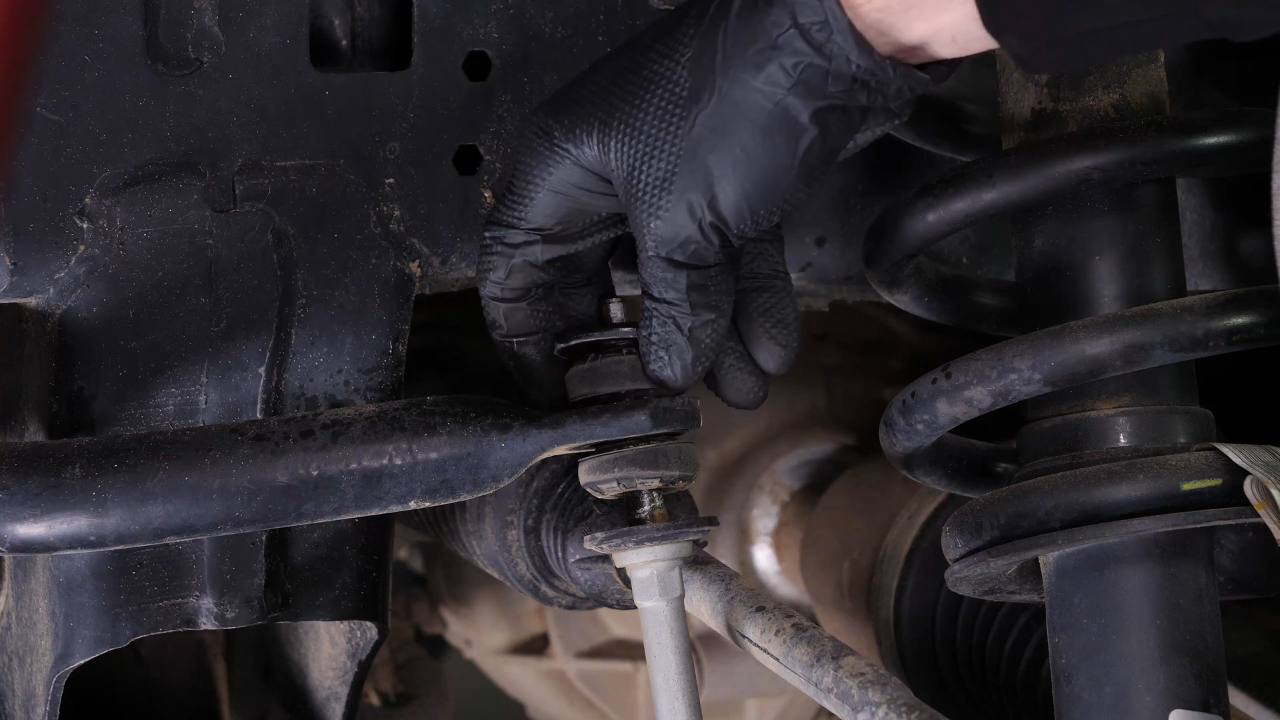 Unscrew the upper ball joint