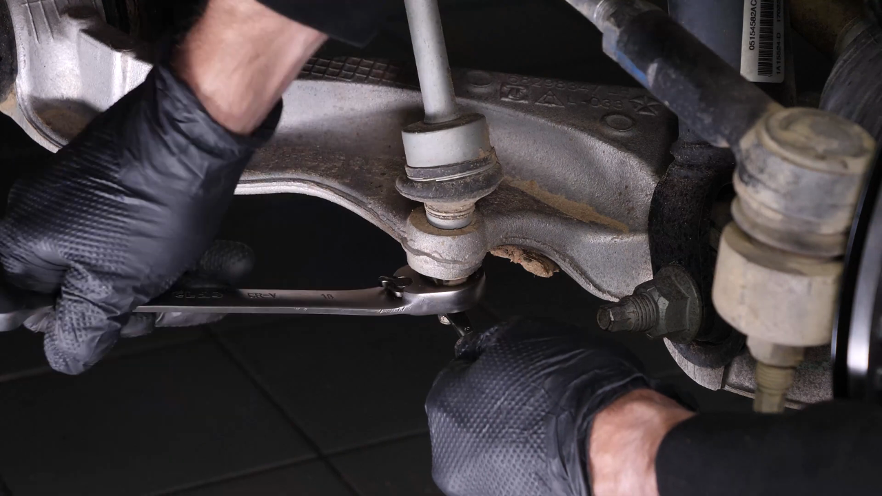 Unscrew the lower ball joint