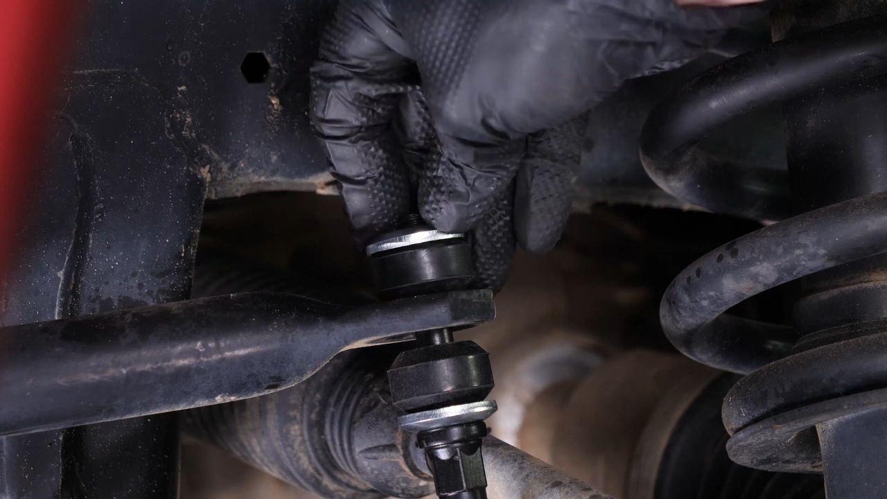 Unscrew the upper ball joint