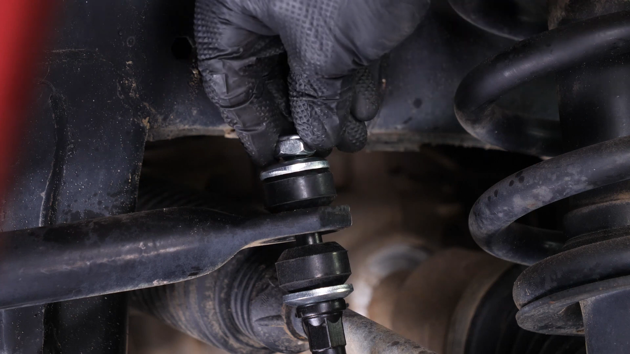 Unscrew the upper ball joint