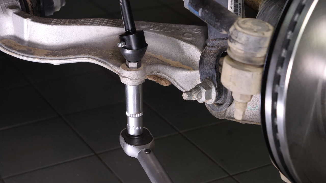 Unscrew the upper ball joint