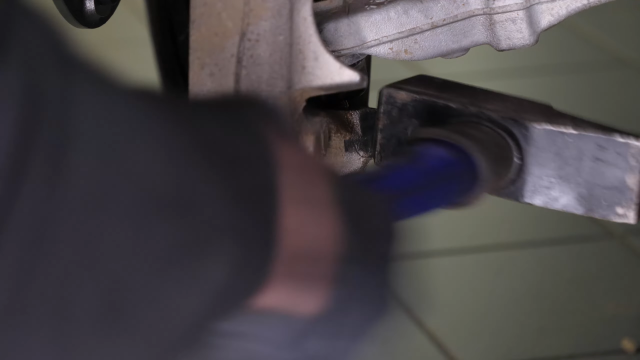 Disconnect the control arms from the wheel knuckle