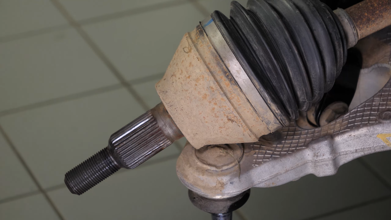 Disconnect the control arms from the wheel knuckle