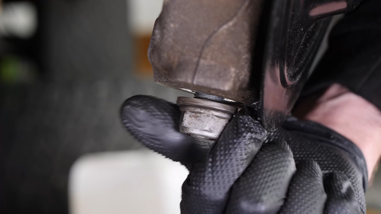 Screw the control arm ball joint nut back