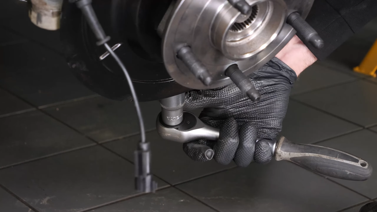 Screw the control arm ball joint nut back
