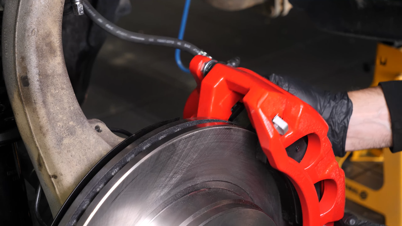 Put the caliper assembly back