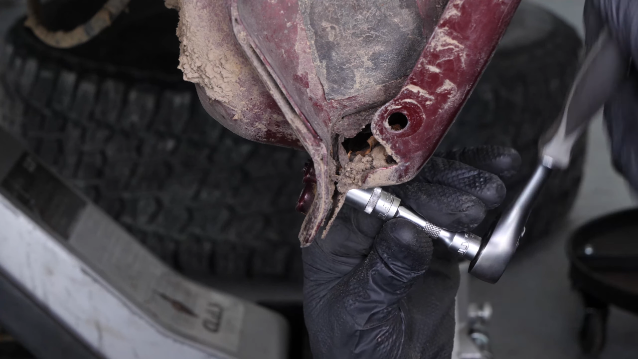 Unscrew the fender retaining bolts