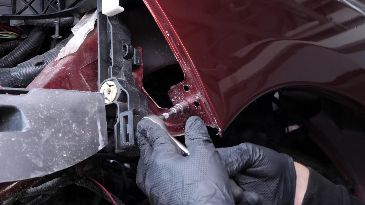 Unscrew the fender retaining bolts