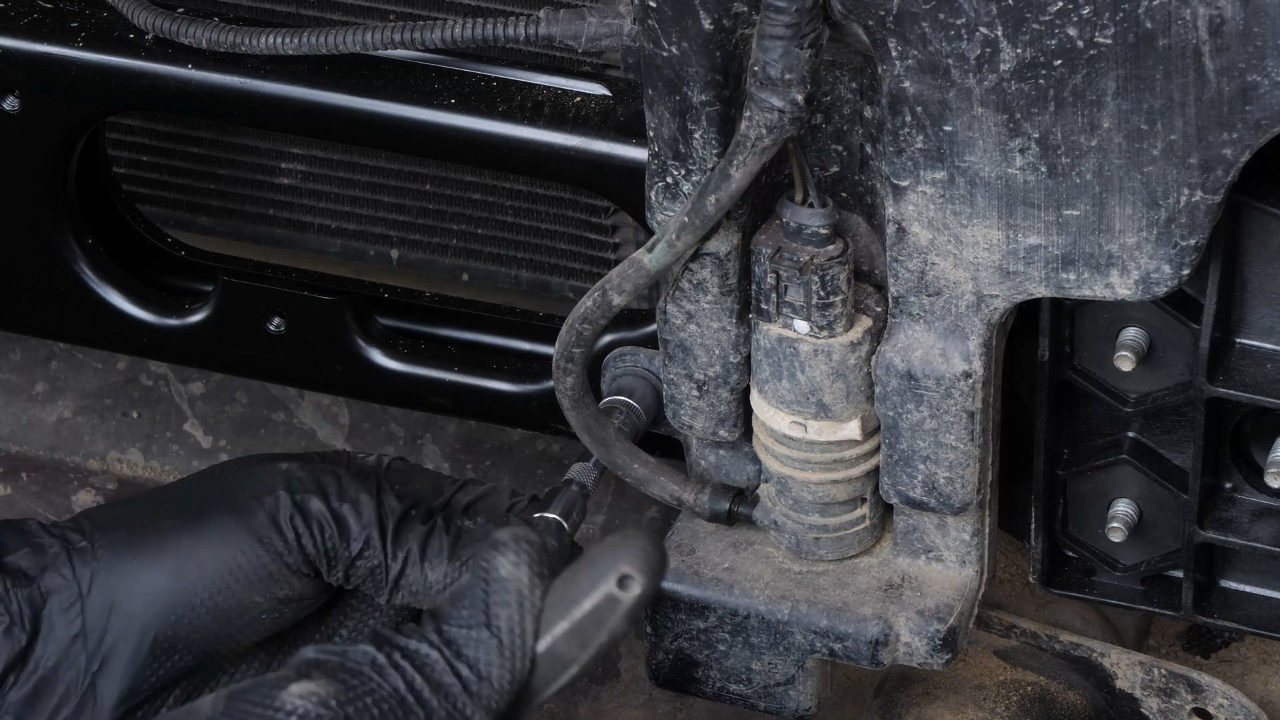 Put the washer pump fluid reservoir back