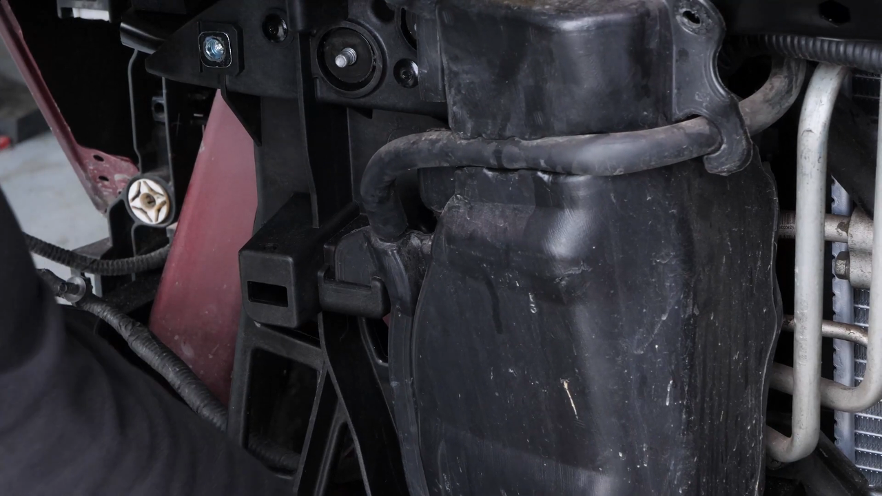 Put the coolant reservoir back