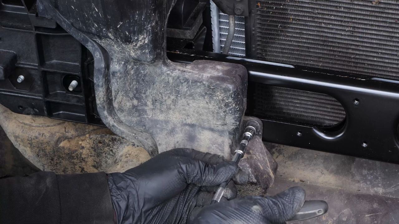 Put the coolant reservoir back