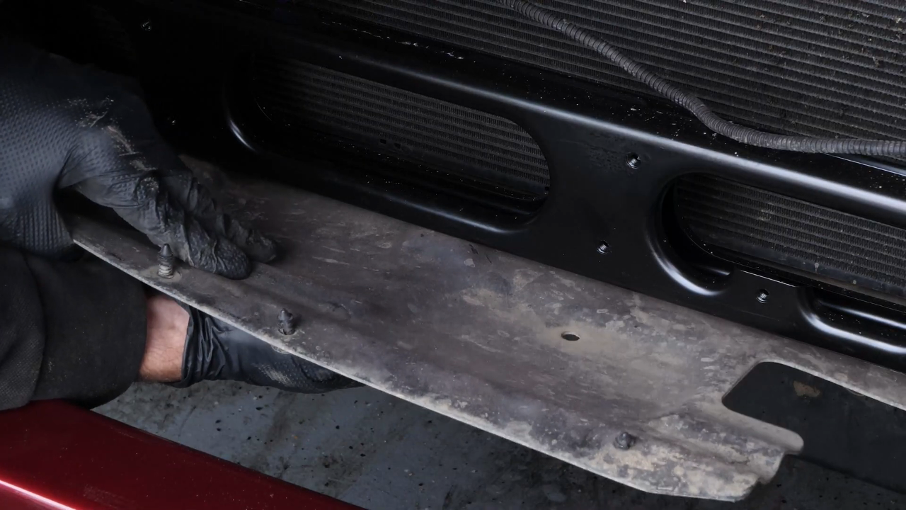Put the bumper cover plastic fastener back