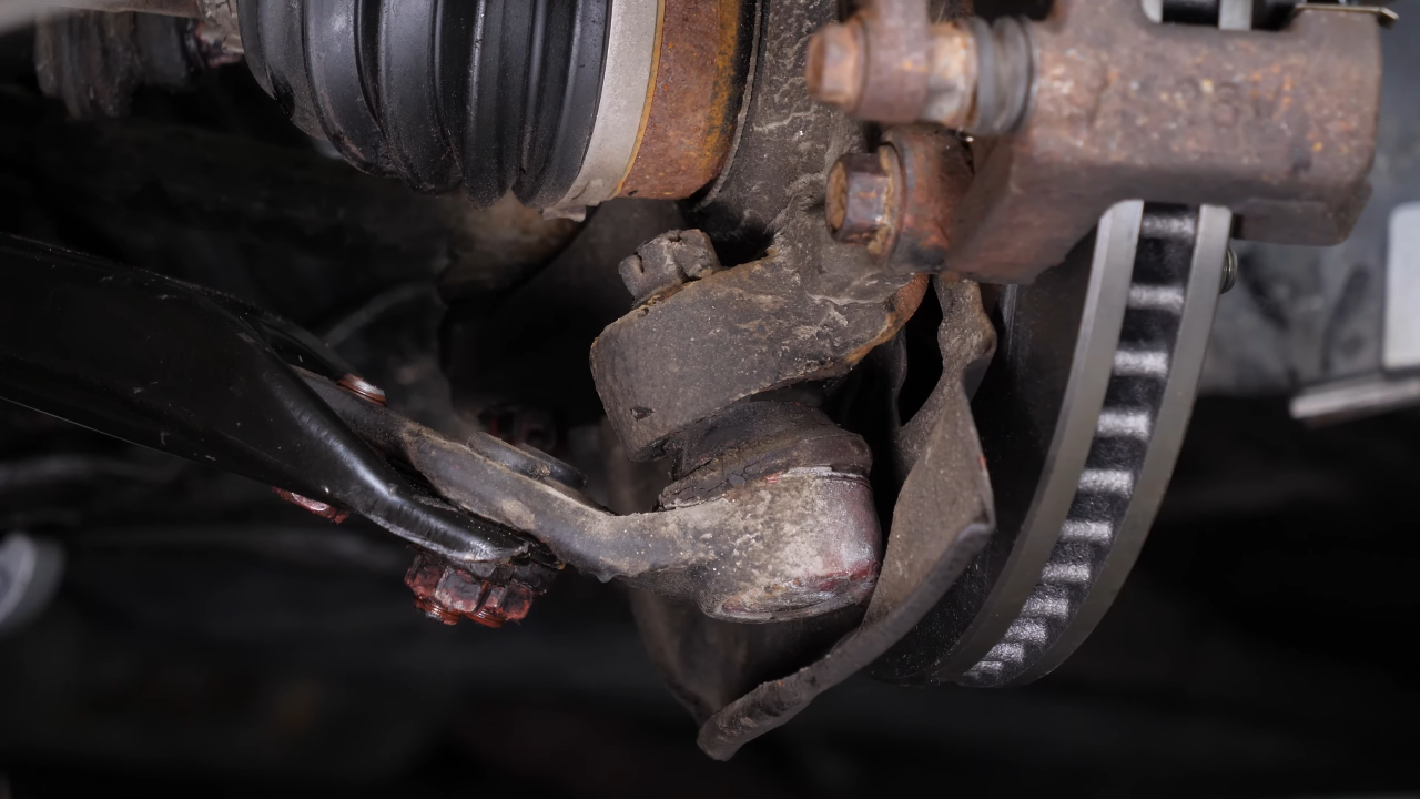 Loosen the lower ball joint upper nut