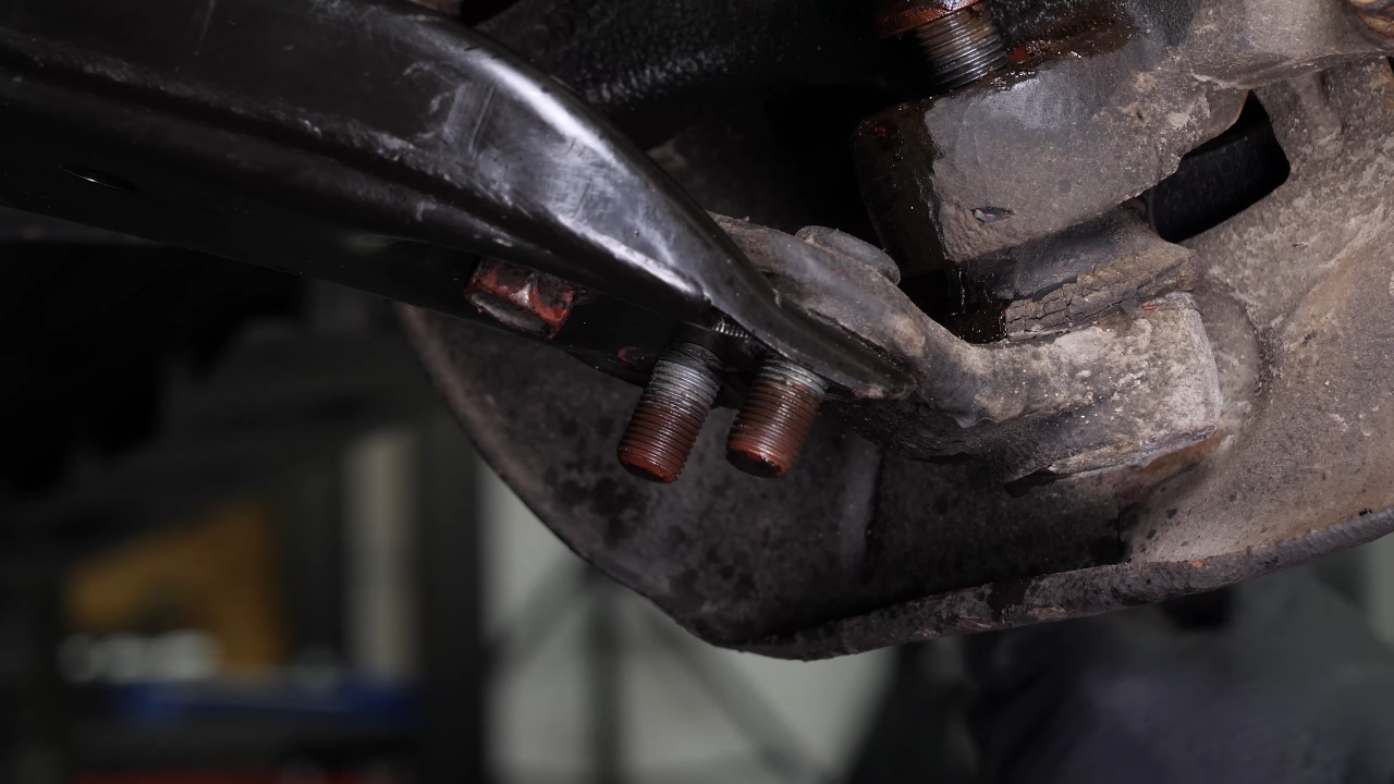 Remove the ball joint holding nuts
