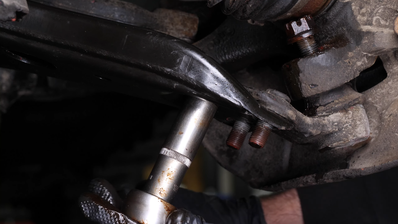 Remove the ball joint holding nuts