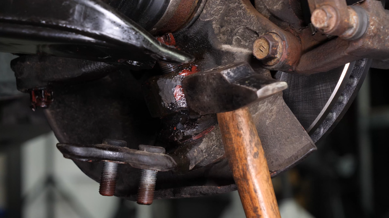 Separate the ball joint from the control arm 