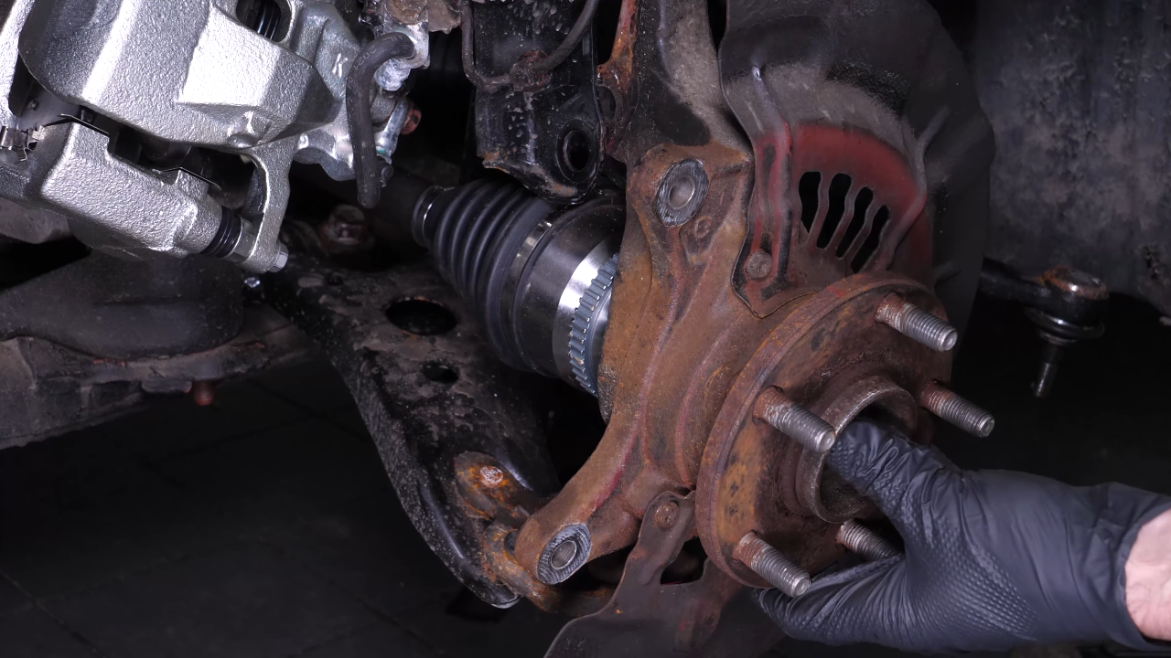 Remove the wheel knuckle