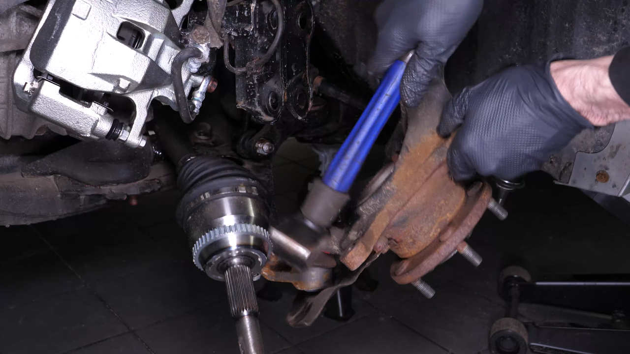 Remove the wheel knuckle