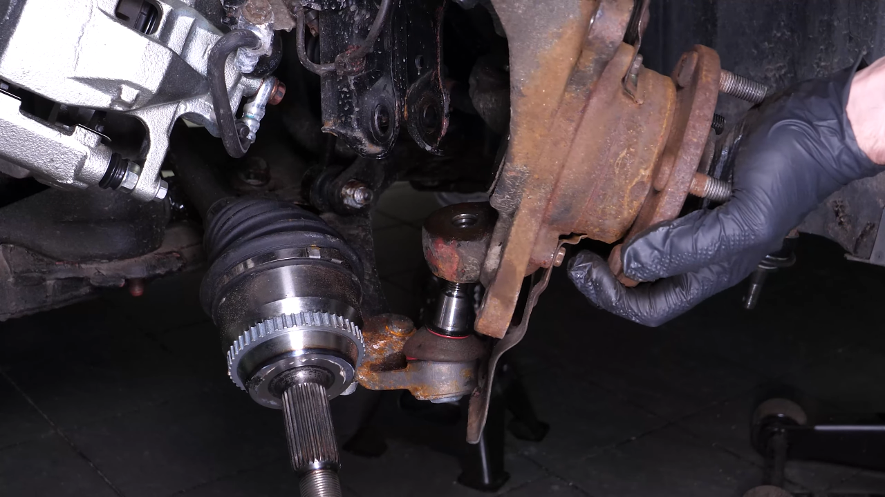 Remove the wheel knuckle