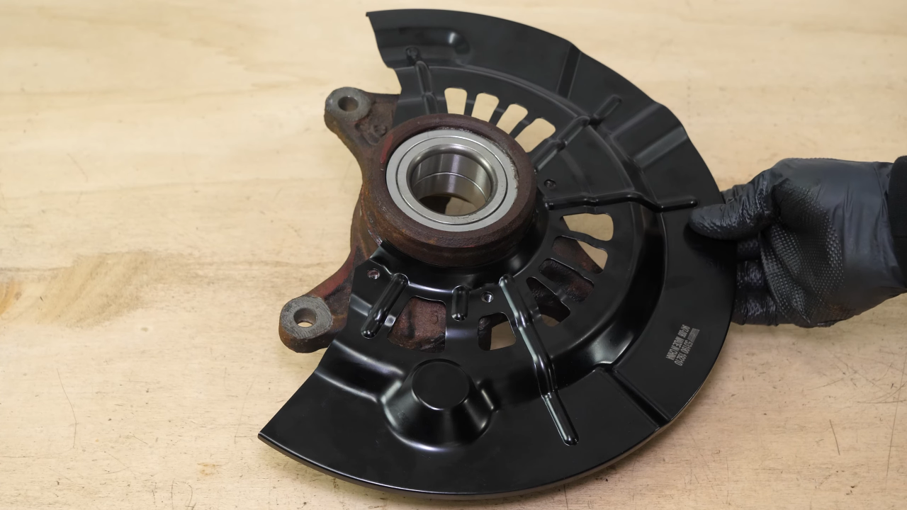 Put the backing plate back