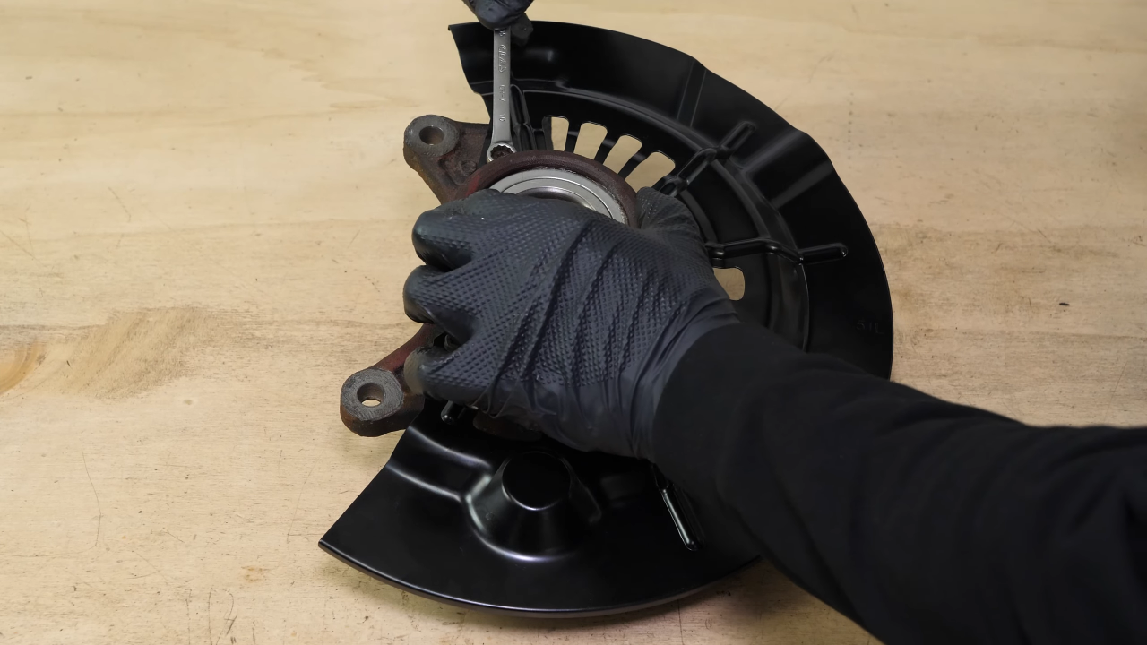 Put the backing plate back