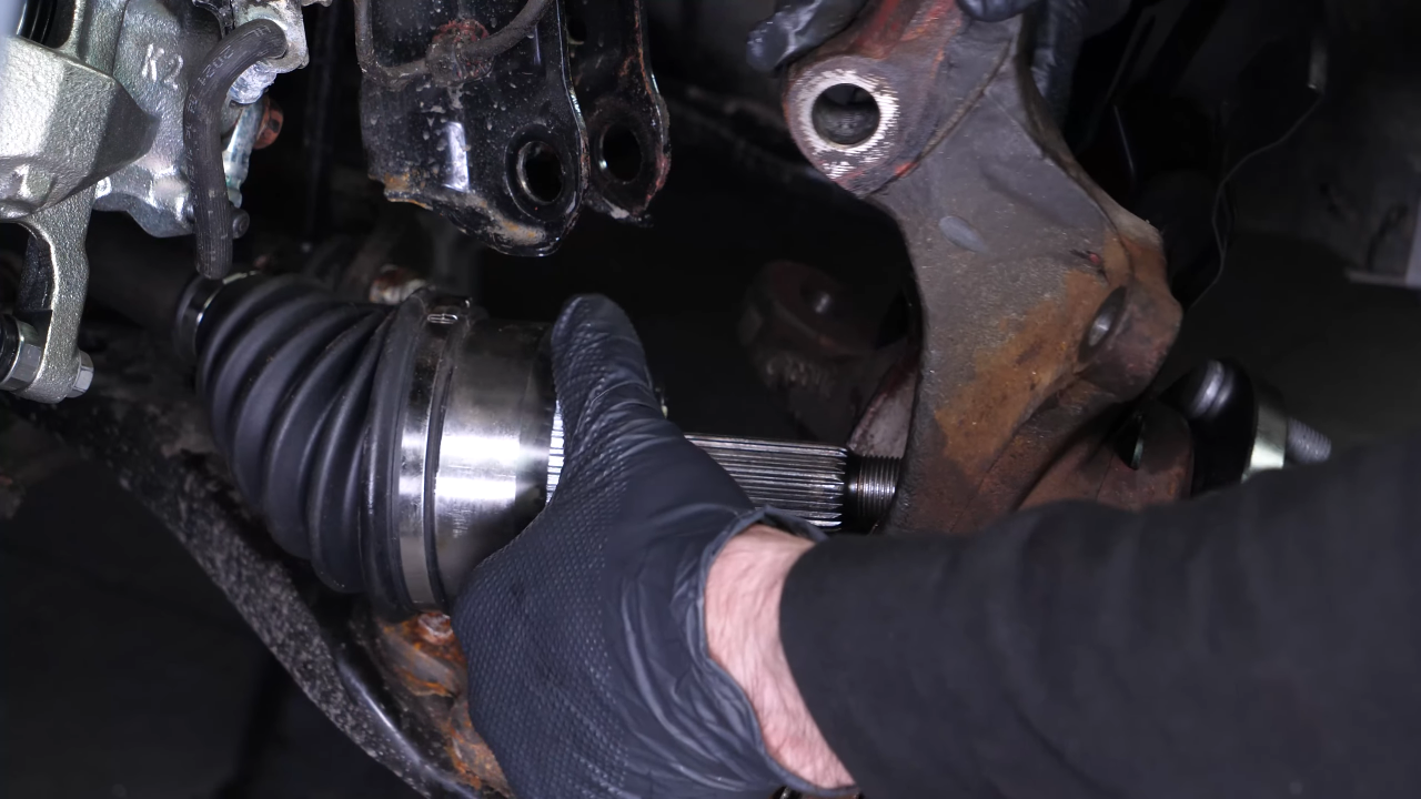 Reinstall the strut in the wheel knuckle