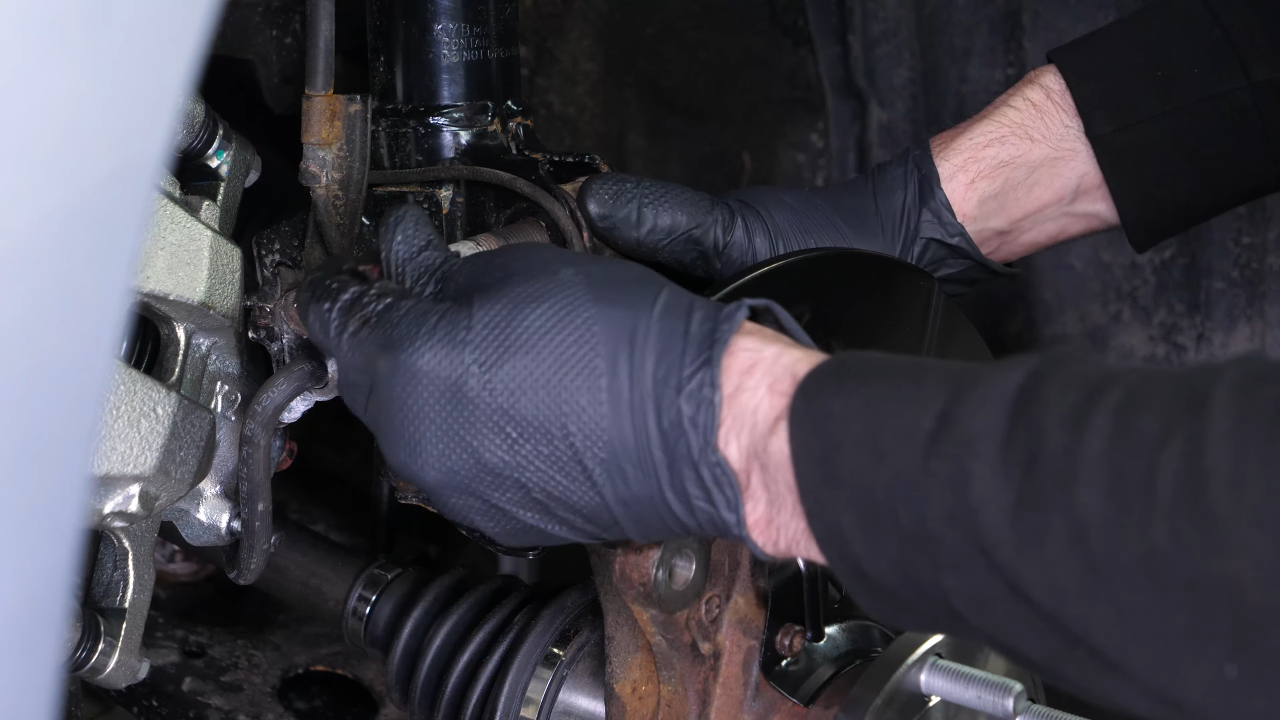 Reinstall the strut in the wheel knuckle