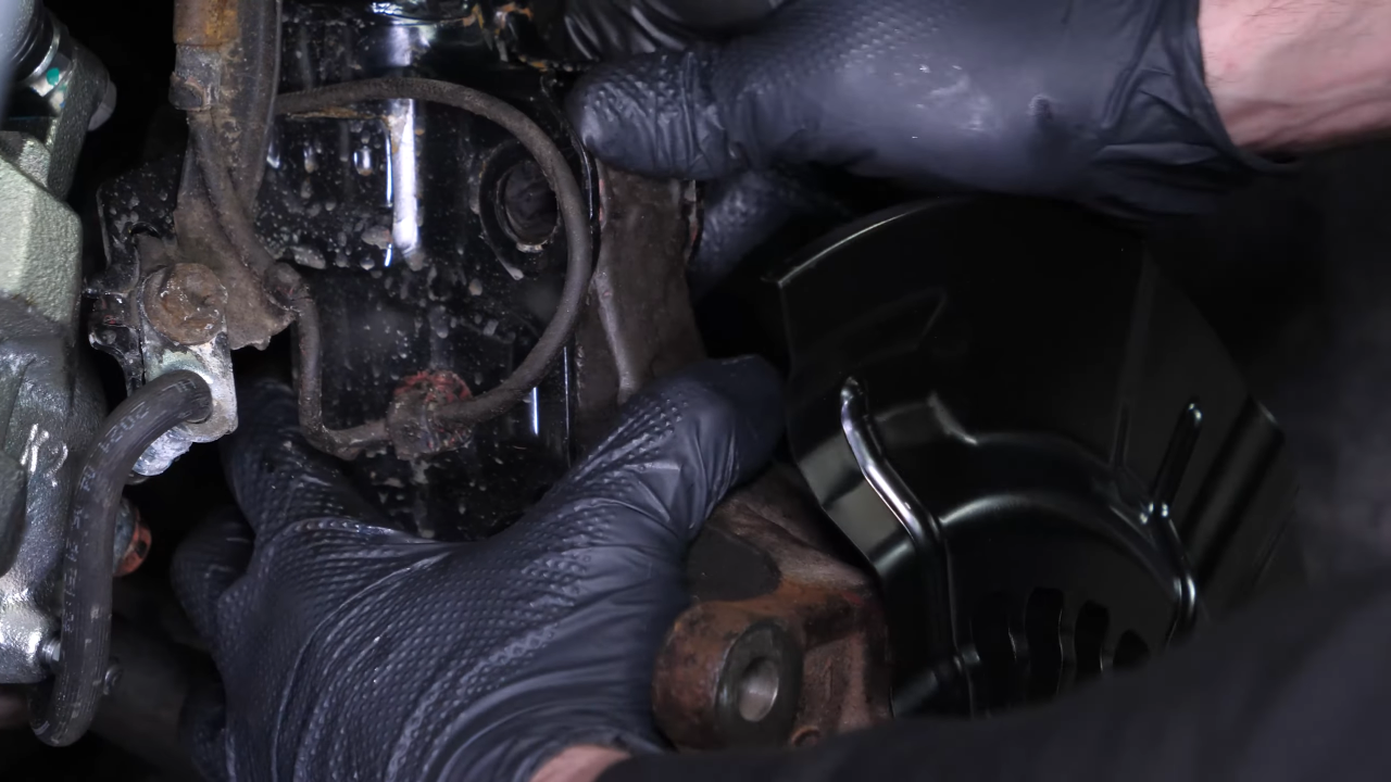 Reinstall the strut in the wheel knuckle