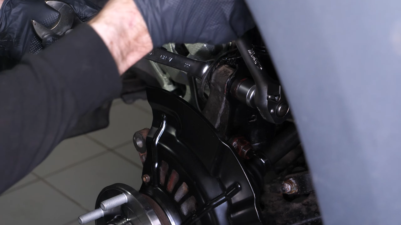 Reinstall the strut in the wheel knuckle