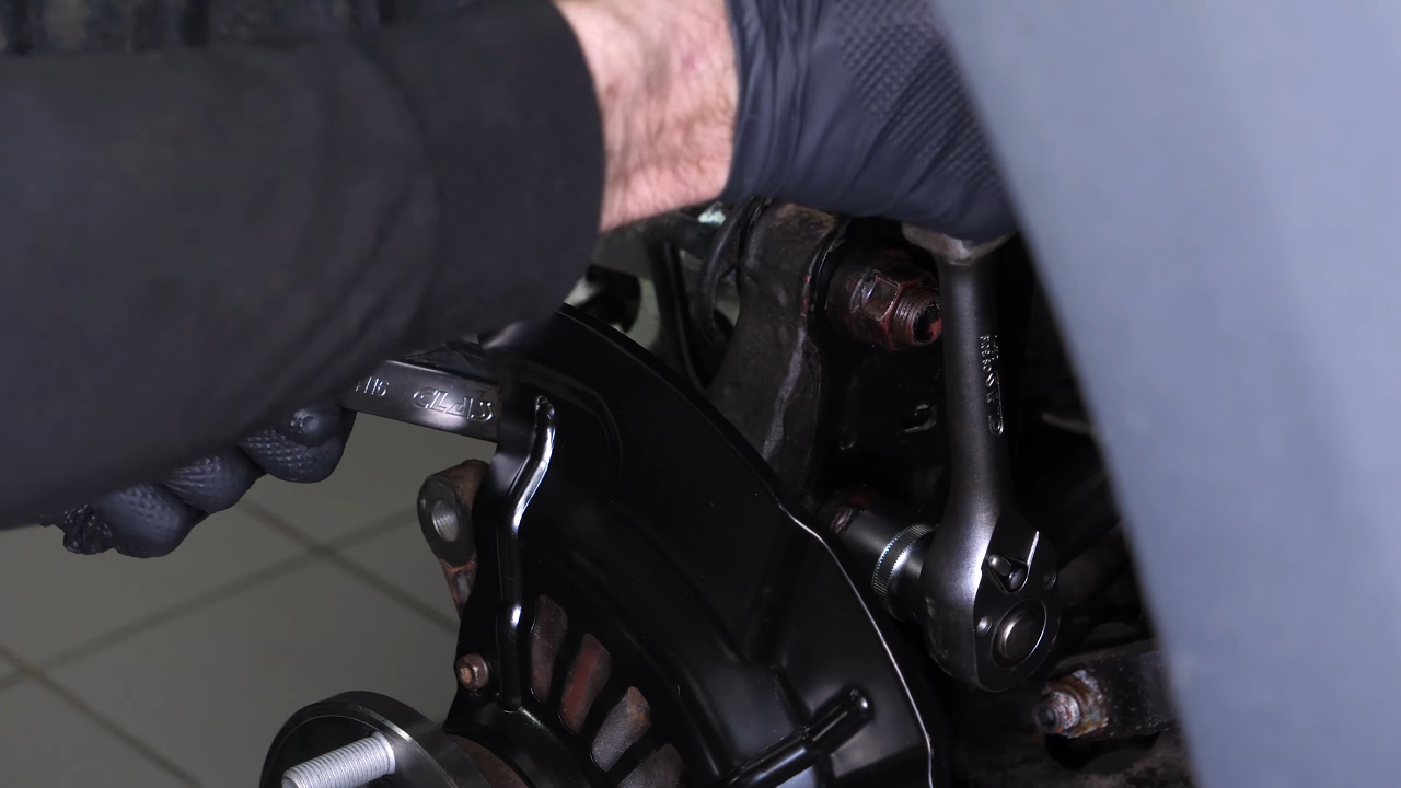 Reinstall the strut in the wheel knuckle