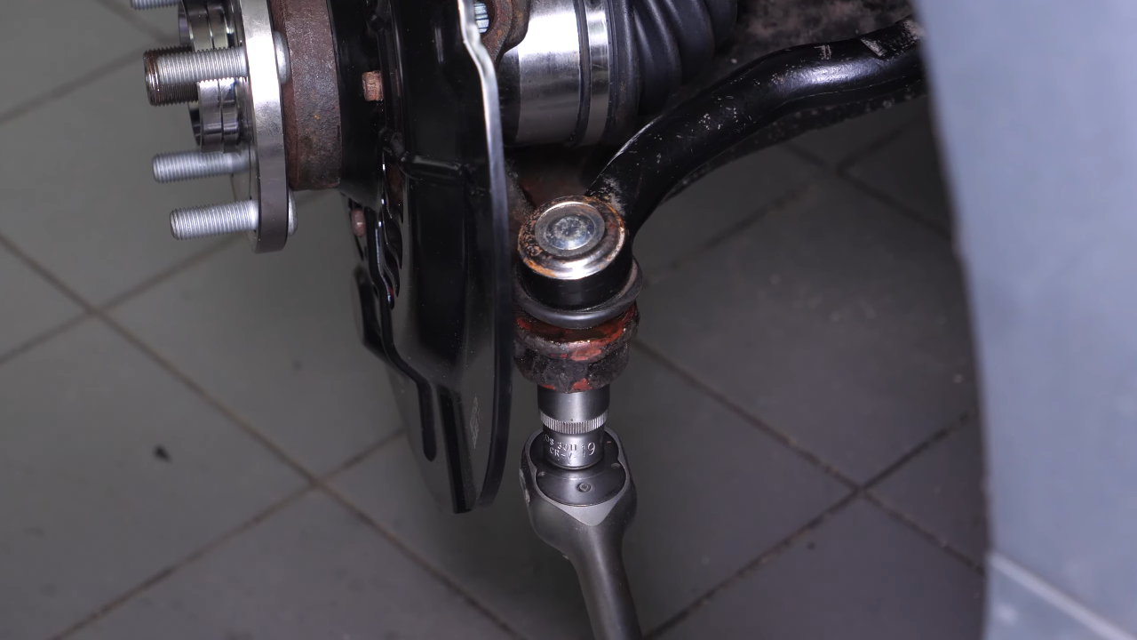 Put the outer tie rod back