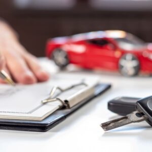 person signing a car contract