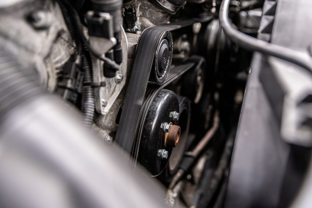 Why Is the Fan Belt Squealing on Acceleration?
