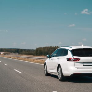 station wagon driving on a highway
