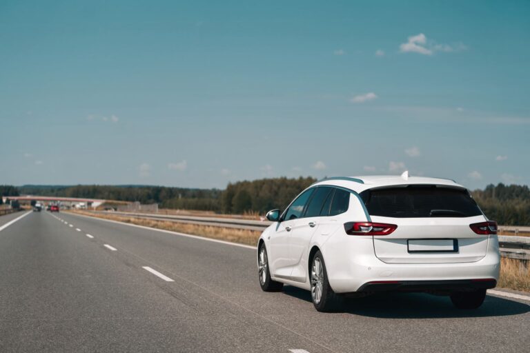station wagon driving on a highway