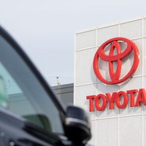 a car and a building with toyota logo