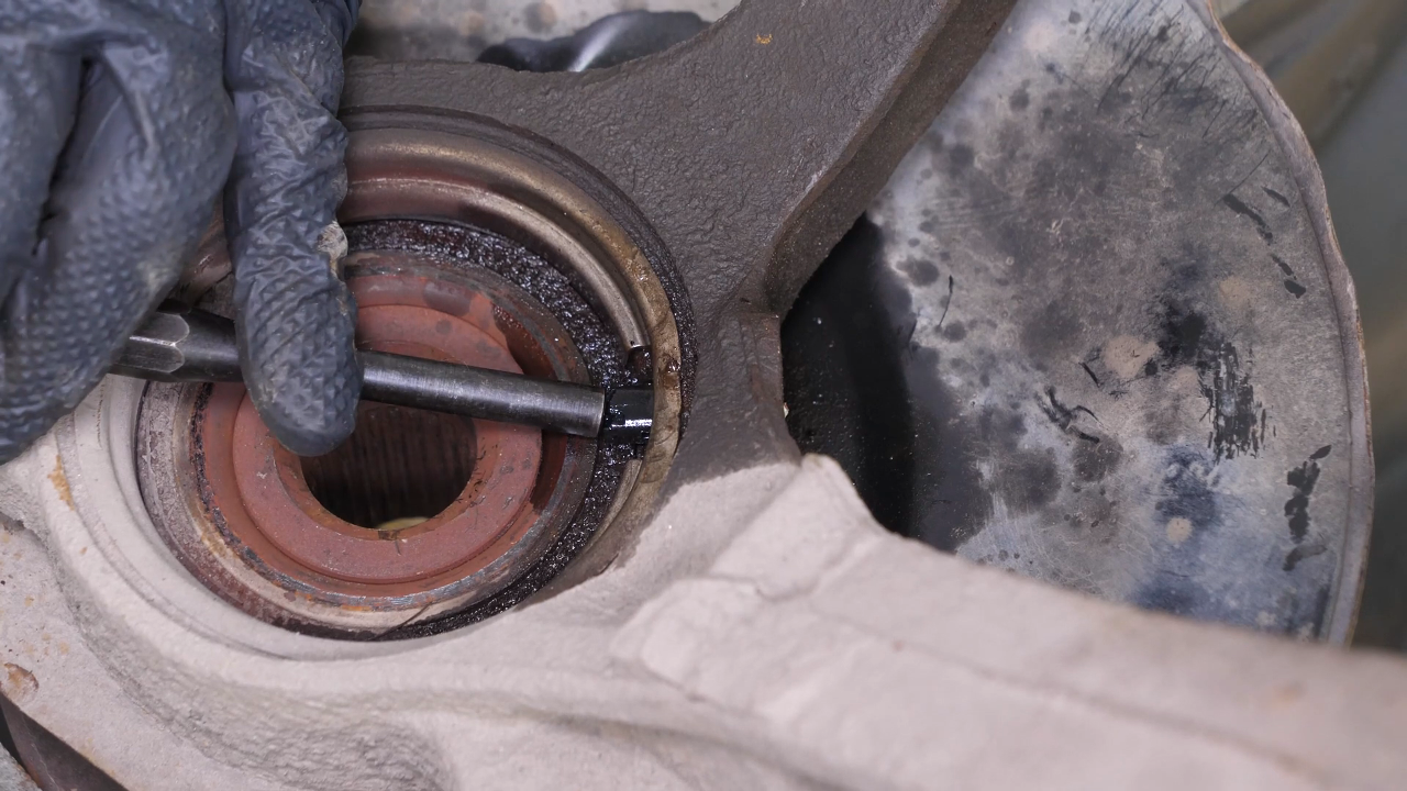 Remove the ABS sensor from the wheel knuckle