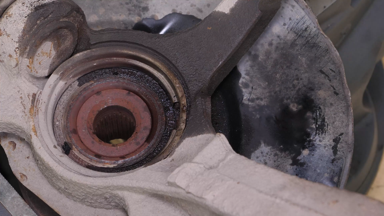 Remove the ABS sensor from the wheel knuckle