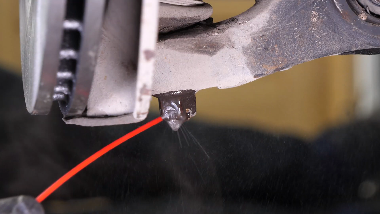 Disconnect the control arms from the wheel knuckle