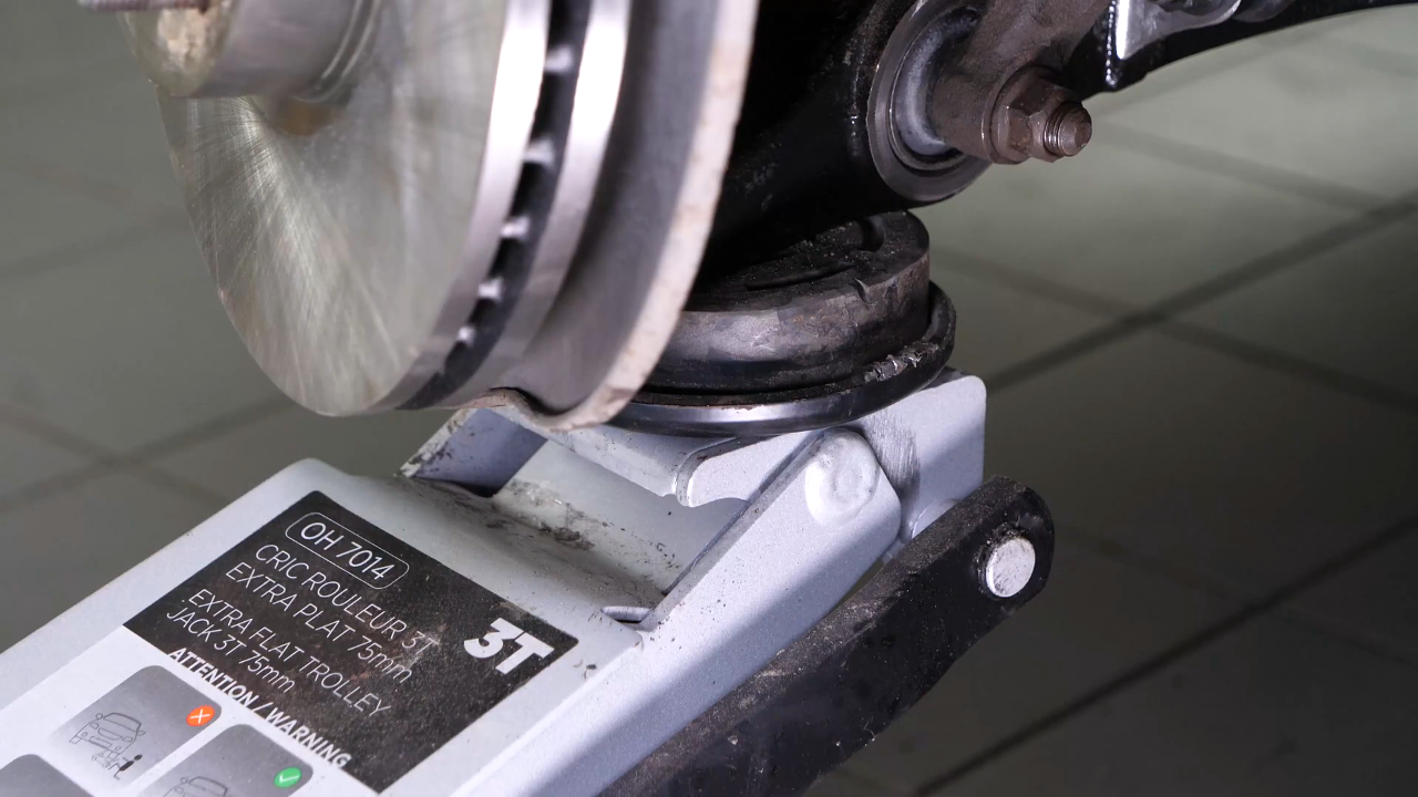 Reinstall the strut in the wheel knuckle