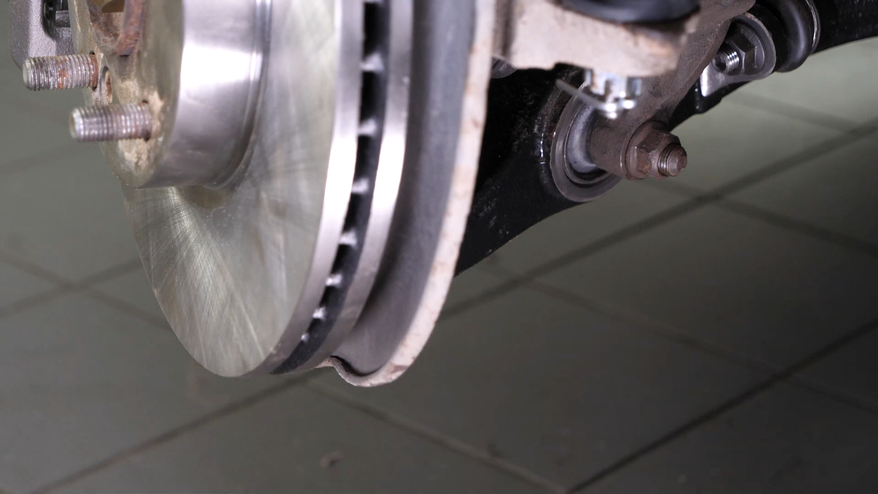Reinstall the strut in the wheel knuckle