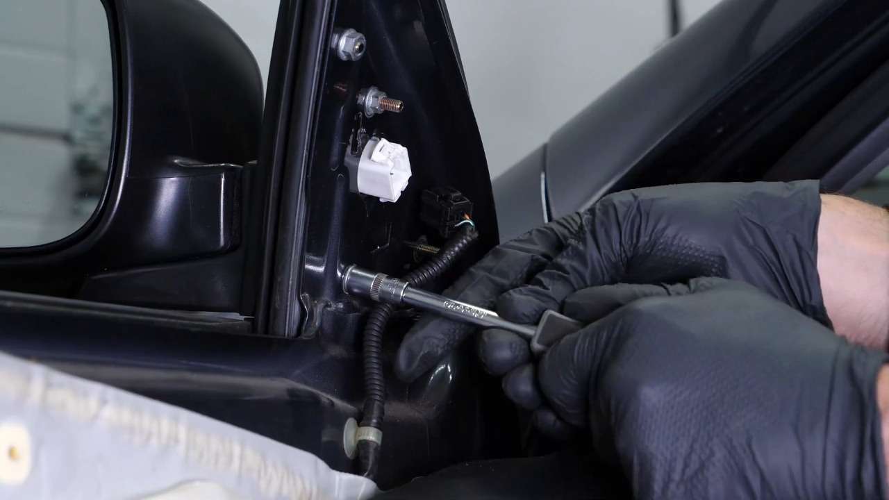 Install the new side view mirror
