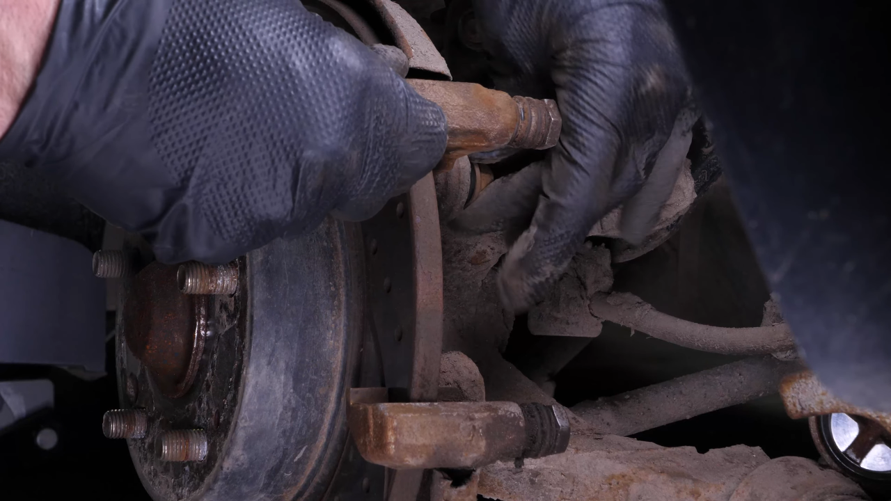 Remove the  brake caliper mount