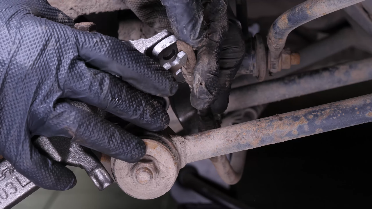 Put the parking brake cable back