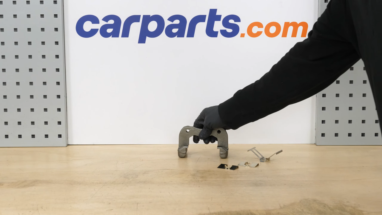 Put the brake caliper mount back on